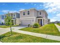 Charming two-story home with well-maintained landscaping and a two-car garage at 5758 Hollingworth Trl, Wesley Chapel, FL 33545