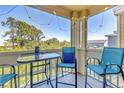 Relaxing screened-in balcony with outdoor seating, perfect for enjoying the view at 115 112Th Ne Ave # 310, St Petersburg, FL 33716