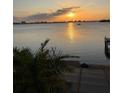 Spectacular sunset over the water, reflecting sunlight off the gentle waves at 1844 Venetian Point Dr, Clearwater, FL 33755