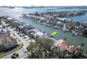 Aerial view of waterfront homes on a canal with easy access to the bay and nearby islands and mainland at 2829 Seabreeze S Dr, Gulfport, FL 33707