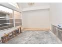 Bright room with a large window, ladder and unfinished floors ready for customization and personalized design at 3876 Darston St, Palm Harbor, FL 34685