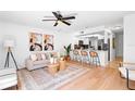 Bright living space with modern decor, wood floors, stylish furniture, and a ceiling fan at 408 S Arrawana Ave # B4, Tampa, FL 33609