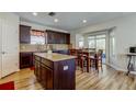 Eat-in kitchen with granite countertops, wood cabinets, and stainless steel appliances at 4250 Warwick Hills Dr, Wesley Chapel, FL 33543