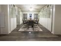 Bright dining room with built-in cabinets and a dining table with seating for six guests at 6166 9Th N Ave, St Petersburg, FL 33710