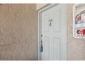 The front door of unit 1721 features a door knocker and key in the lock at 7210 N Manhattan Ave # 1721, Tampa, FL 33614