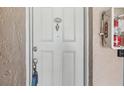 The front door of unit 1721 features a door knocker and key in the lock at 7210 N Manhattan Ave # 1721, Tampa, FL 33614