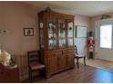 Dining area featuring a classic wooden china cabinet, showcasing decorative dishware at 9208 37Th N St, Pinellas Park, FL 33782
