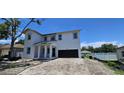 Elegant two-story home with a modern design, showcasing a welcoming entrance and attached garage at 1405 50Th N Ave, St Petersburg, FL 33703