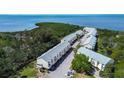 Overhead of townhouse community by the water with manicured landscaping at 1500 Sunset Rd # G4, Tarpon Springs, FL 34689