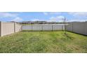 Serene backyard view with privacy fence and calming water views, perfect for relaxation at 18184 Turning Leaf Cir, Land O Lakes, FL 34638