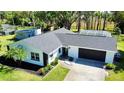 Aerial view of home showcasing the well maintained roof and landscaping at 210 Lake Hobbs Rd, Lutz, FL 33548