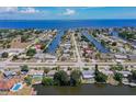 Aerial view of waterfront community with canals and houses at 21838 Edgewater Dr, Port Charlotte, FL 33952