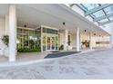 Elegant condo entrance with floor to ceiling windows, columns, and sleek modern design at 2910 W Barcelona St # 403, Tampa, FL 33629
