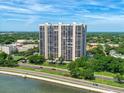Striking exterior view of a high-rise building with manicured landscaping and waterfront access at 3301 Bayshore Blvd # 2108B, Tampa, FL 33629