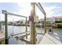A well maintained private boat lift on a dock ensures easy and secure boat storage for waterfront living at 4319 Harbor House Dr, Tampa, FL 33615