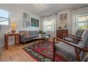 Comfortable living room featuring hardwood floors and plenty of natural light from the windows at 604 W Hilda St, Tampa, FL 33603