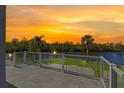 Enjoy the view from this beautiful balcony overlooking the tranquil waterfront, perfect for relaxation and entertainment at 7049 Peninsular Dr, New Port Richey, FL 34652