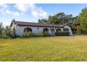 Lovely home featuring classic architectural details, lush green lawn, and a welcoming, well-maintained landscape at 1032 26Th S Ave, St Petersburg, FL 33705