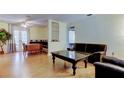 Bright and airy living room featuring hardwood floors and French doors to a porch at 10514 52Nd N Ave, St Petersburg, FL 33708