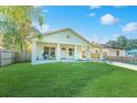 Quaint single-Gathering home with a well-manicured lawn, welcoming front porch and attached carport at 1313 E Cayuga St, Tampa, FL 33603