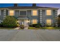 Beautiful townhome featuring an inviting exterior view at dusk at 14019 Notreville Way, Tampa, FL 33624