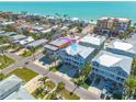Captivating aerial view of beachfront condos and charming neighborhood setting at 16306 1St E St, Redington Beach, FL 33708