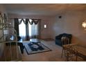 Cozy living room with carpet, front window, and comfortable seating at 2284 Philippine Dr # 41, Clearwater, FL 33763
