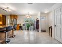 Open floor plan with an eat in kitchen that includes an entry to the home at 2755 Merlin Way, Clearwater, FL 33761