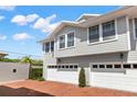Beautiful townhome featuring a two-car garage and well-maintained landscaping at 2920 W El Prado Blvd # 4, Tampa, FL 33629