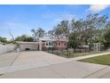 Well-maintained home featuring a carport and gated driveway at 5010 45Th N Ave, St Petersburg, FL 33709