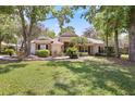 Beautiful one-story home featuring brick accents, lush landscaping, and a well-maintained front lawn at 6109 Kingbird Manor Dr, Lithia, FL 33547