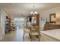 Open living area with views of the water, comfortable seating, and a dining area at 7300 Sun Island S Dr # 202, South Pasadena, FL 33707