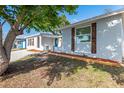Charming home with mature trees, fresh landscaping, and a well-maintained lawn at 9216 Mark Twain Ln, Port Richey, FL 34668