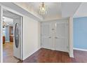 Inviting entryway featuring hardwood floors, decorative lighting, and access to other rooms in the unit at 2403 S Ardson Pl # 902B, Tampa, FL 33629