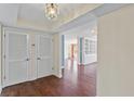 Charming entryway showcases hardwood floors, closet, and a glimpse into the spacious living area at 2403 S Ardson Pl # 902B, Tampa, FL 33629