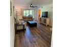 Inviting living room features modern decor and a ceiling fan at 3001 58Th Ave S # 1103, St Petersburg, FL 33712