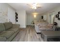 Living room with vinyl flooring, neutral paint, and an open floor plan at 320 N Bayshore Blvd # 208, Clearwater, FL 33759