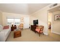 Bright living room featuring neutral tones, comfortable seating, and a view to the bedroom at 4910 Bay Ne St # 308, St Petersburg, FL 33703