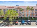 Condo complex featuring covered parking, multiple balconies and mature landscaping at 5000 Culbreath Key Way # 8-308, Tampa, FL 33611