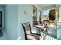 Inviting front porch with comfortable seating, perfect for enjoying the neighborhood views at 527 Manns Harbor Dr, Apollo Beach, FL 33572