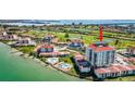 The luxurious waterfront condo showcases a community pool, golf course, and serene bay views at 6265 Sun Blvd # 1201, St Petersburg, FL 33715