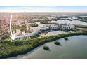 Scenic aerial view showcases a residential complex surrounded by lush greenery and calm waters at 6495 Shoreline Dr # 8106, St Petersburg, FL 33708