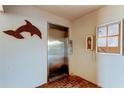 Elevator and wall mounted bulletin board in the condo common area at 895 S Gulfview Blvd # 309, Clearwater Beach, FL 33767