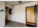 Condo entrance with a decorative dolphin, and the unit door with secure access features at 895 S Gulfview Blvd # 309, Clearwater Beach, FL 33767