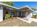 Exterior shot showing decorative posts, lush landscaping and a fresh exterior paint job at 10426 109Th St, Seminole, FL 33778