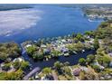 Beautiful aerial shot of lakefront homes with docks and waterfront access on a sunny day at 1162 Tookes Rd, Tarpon Springs, FL 34689