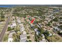 A bird's eye view highlights this home's location nestled in a vibrant neighborhood near the water at 146 82Nd N Ave, St Petersburg, FL 33702