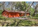 Attractive single-story home featuring a one-car garage and mature landscaping at 33357 Westwood Dr, Ridge Manor, FL 33523