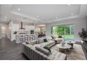 Bright, open-concept living space with modern furnishings and a seamless flow to the outdoor area at 4787 Majestic Hills Loop, Brooksville, FL 34601