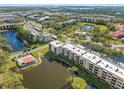 Gorgeous aerial view of the condo community featuring beautiful lake views at 6070 80Th N St # 104, St Petersburg, FL 33709
